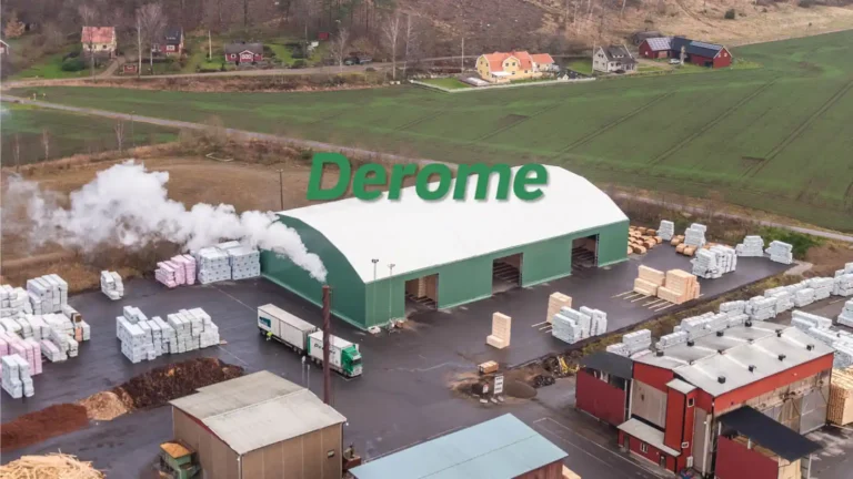 Deromes nya lagertält med gröna sidor och vitt tak på ett industriområde.