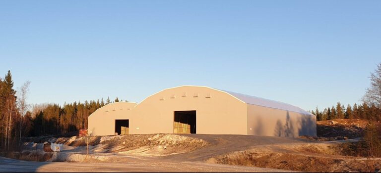 Limestone storage facility at SMA Mineral in two grey fabric structures from Hallbyggarna Jonsereds. Fabric Covered Buildings
