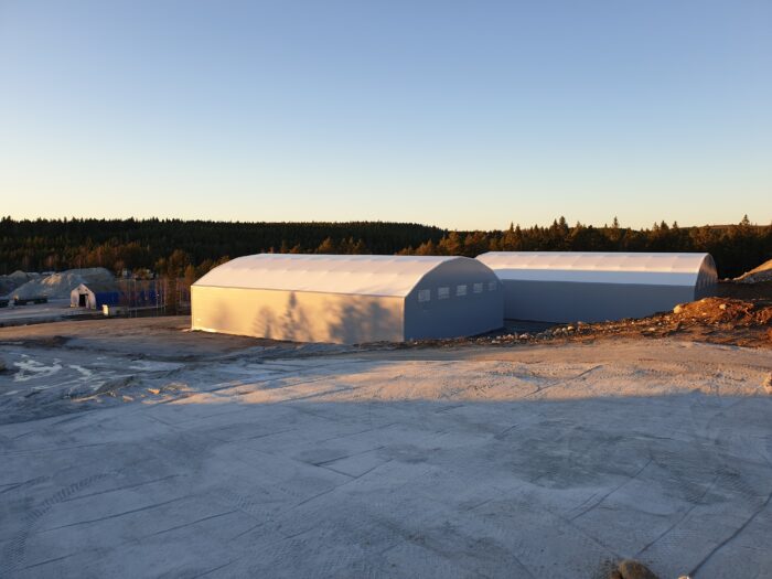 Double fabric structures in a grey colour and white roof at MSMA Mineral, which shall be used as a limestone storage facility